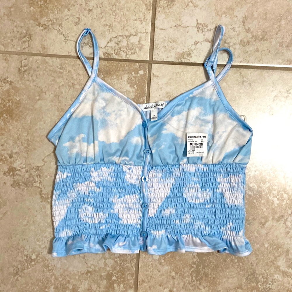 Cloud print spaghetti strap top with blue buttons and ruffles.
